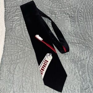 Black Novelty Tie with Toothpaste Design “brush daily by Vicky Davis”